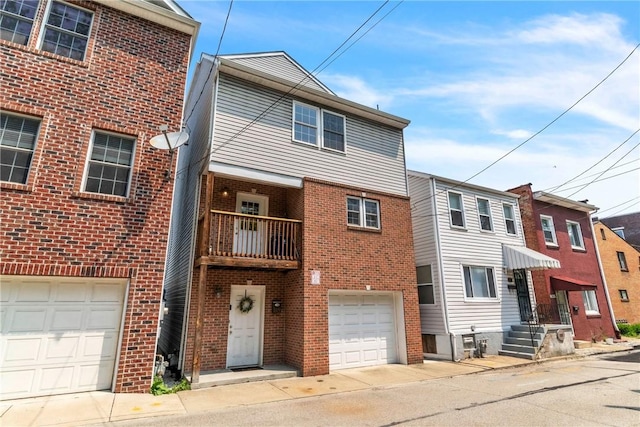 1109 Mary Ann, South Side, PA 15203 - view of front of house featuring an attached garage, brick siding, and driveway