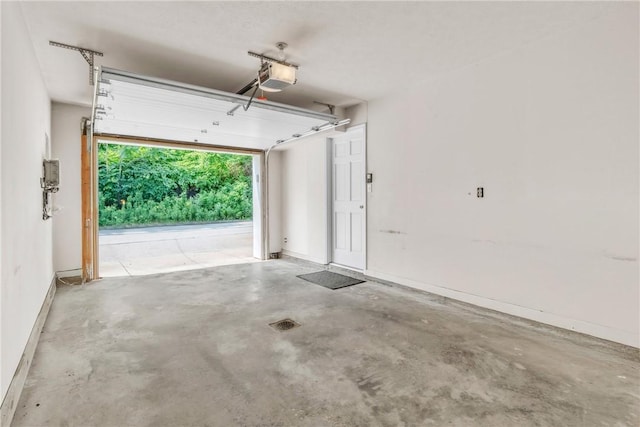 1109 Mary Ann, South Side, PA 15203 - garage featuring a garage door opener and baseboards