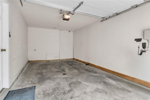 1109 Mary Ann, South Side, PA 15203 - garage featuring a garage door opener and baseboards