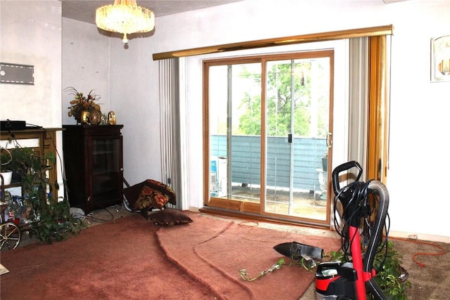 5388 Warble St, Garfield, PA 15224 - entryway featuring carpet floors and a chandelier