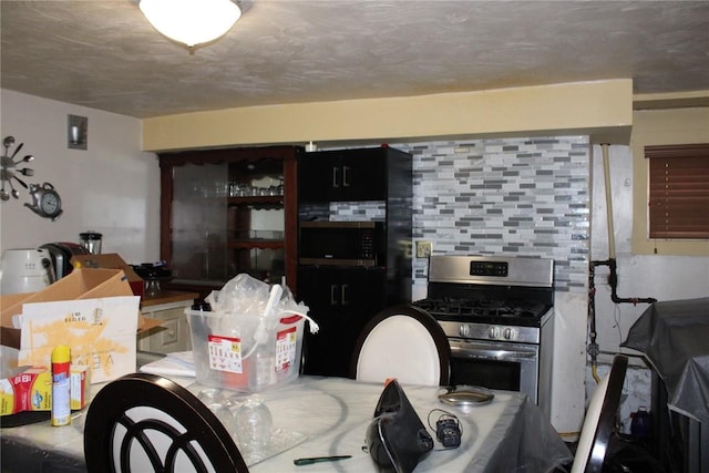 5388 Warble St, Garfield, PA 15224 - kitchen with appliances with stainless steel finishes and backsplash
