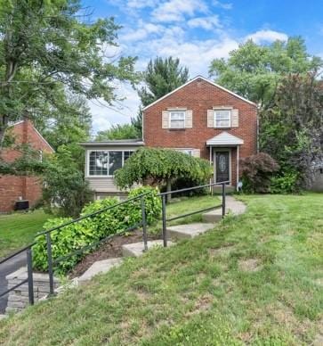 147 Rodilin Dr, Penn Hills, PA 15235 - view of front of house featuring a front lawn and brick siding