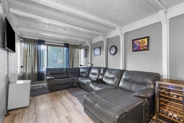 147 Rodilin Dr, Penn Hills, PA 15235 - living area with wine cooler, wood finished floors, and a textured ceiling