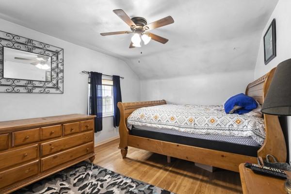 147 Rodilin Dr, Penn Hills, PA 15235 - bedroom featuring light wood finished floors, vaulted ceiling, and a ceiling fan