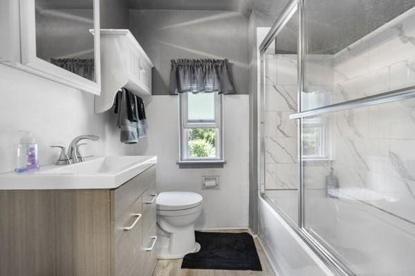 147 Rodilin Dr, Penn Hills, PA 15235 - full bathroom featuring vanity, combined bath / shower with glass door, and wood finished floors