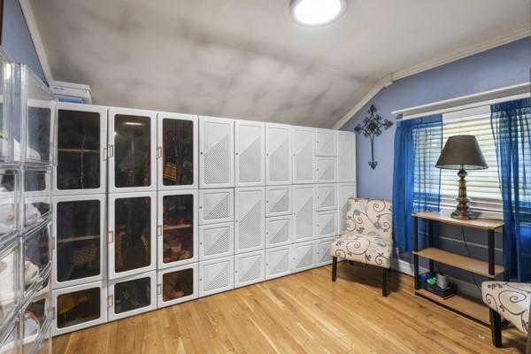 147 Rodilin Dr, Penn Hills, PA 15235 - sitting room featuring lofted ceiling, wood finished floors, and ornamental molding
