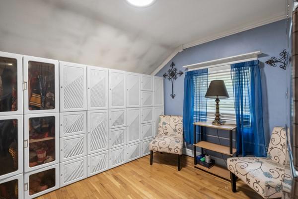 147 Rodilin Dr, Penn Hills, PA 15235 - sitting room with lofted ceiling, wood finished floors, and crown molding