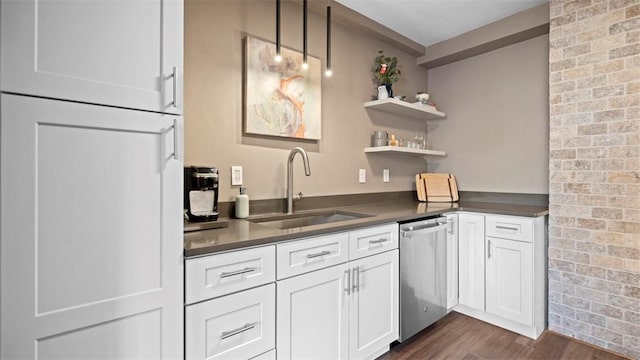128 N Craig St Unit 505, Oakland, PA 15213 - kitchen featuring stainless steel dishwasher, dark countertops, dark wood-style floors, white cabinetry, and open shelves