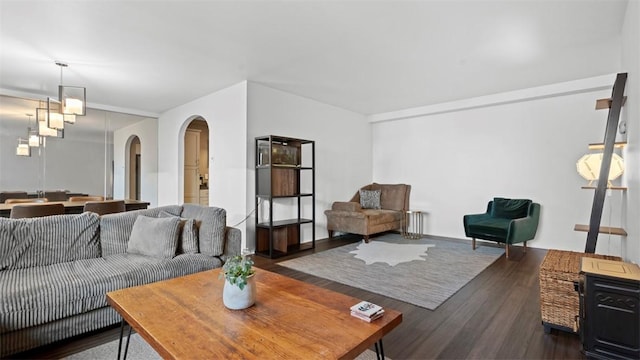128 N Craig St Unit 505, Oakland, PA 15213 - living area featuring arched walkways, dark wood-type flooring, and radiator