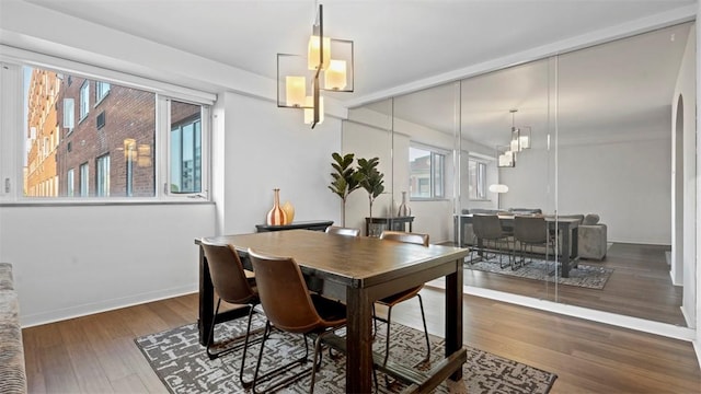 128 N Craig St Unit 505, Oakland, PA 15213 - dining area with wood finished floors and a chandelier
