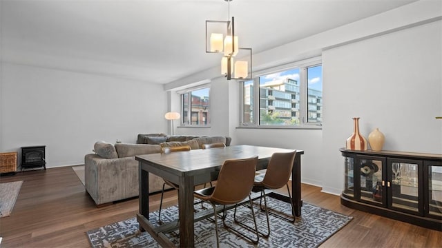 128 N Craig St Unit 505, Oakland, PA 15213 - dining space featuring a wood stove and wood finished floors