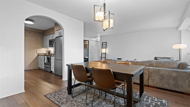 128 N Craig St Unit 505, Oakland, PA 15213 - dining area with arched walkways and wood finished floors