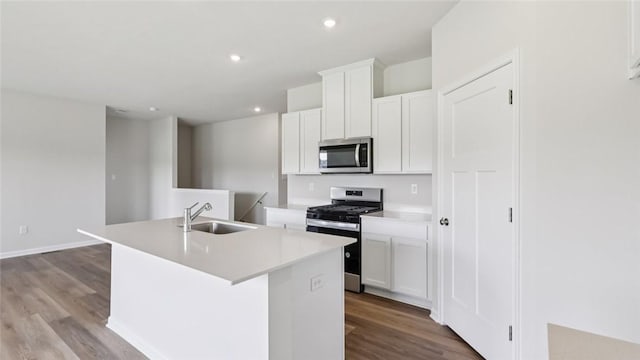 163 Smith Ln, Chippewa Twp, PA 15010 - kitchen featuring stainless steel appliances, a kitchen island with sink, wood finished floors, white cabinetry, and recessed lighting