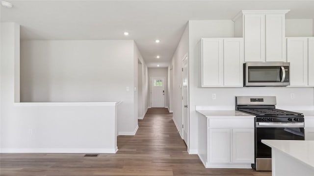 163 Smith Ln, Chippewa Twp, PA 15010 - kitchen with stainless steel appliances, recessed lighting, light countertops, and white cabinetry