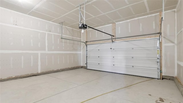 163 Smith Ln, Chippewa Twp, PA 15010 - garage featuring a garage door opener and baseboards