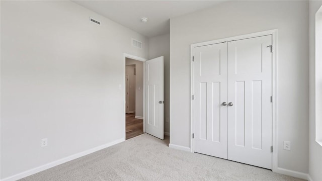 163 Smith Ln, Chippewa Twp, PA 15010 - unfurnished bedroom featuring carpet floors and a closet