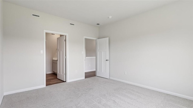 163 Smith Ln, Chippewa Twp, PA 15010 - unfurnished bedroom with carpet floors and ensuite bath