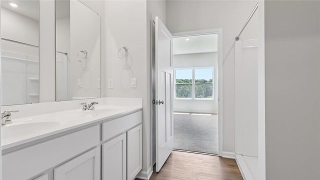 163 Smith Ln, Chippewa Twp, PA 15010 - bathroom featuring double vanity and wood finished floors