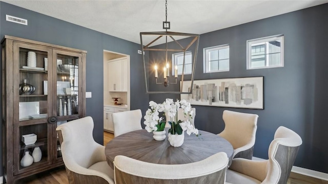 412 Barons Ct, Peters Twp, PA 15367 - dining room featuring a chandelier and wood finished floors