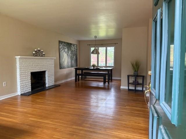 465 Chadwick St, Sewickley, PA 15143 - living area featuring wood finished floors and a brick fireplace