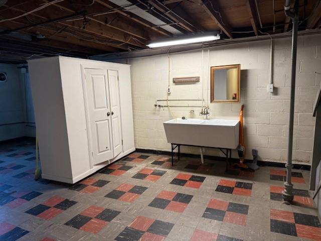 465 Chadwick St, Sewickley, PA 15143 - below grade area with tile patterned floors and a sink
