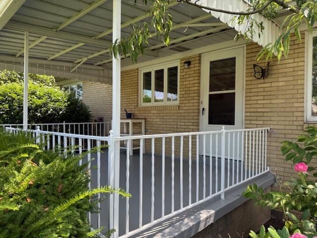 465 Chadwick St, Sewickley, PA 15143 - view of exterior entry featuring brick siding and covered porch