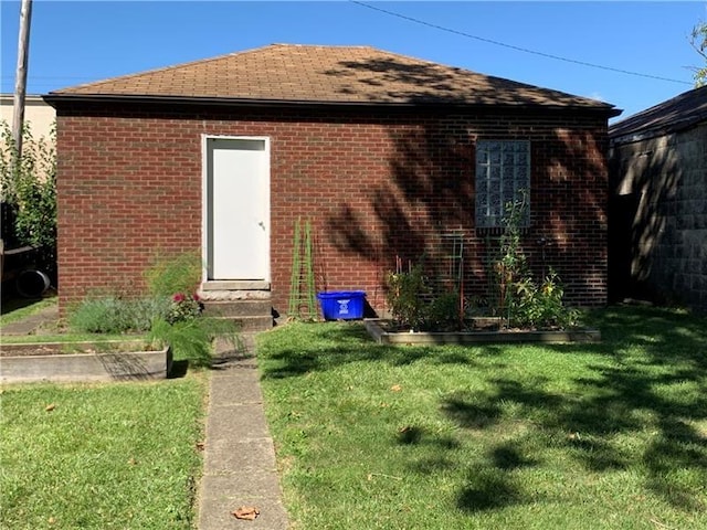 1606 Maryland Ave, West Mifflin, PA 15122 - back of property featuring a lawn, entry steps, and a shingled roof