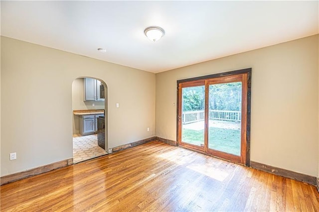 9502 Frankstown, Penn Hills, PA 15235 - unfurnished room with arched walkways and light wood-style floors