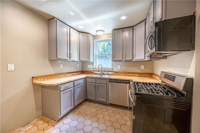 9502 Frankstown, Penn Hills, PA 15235 - kitchen with appliances with stainless steel finishes, wooden counters, gray cabinets, recessed lighting, and light tile patterned flooring