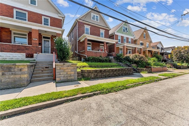 312 Edgewood Ave, Trafford, PA 15085 - view of front of property featuring brick siding and a porch
