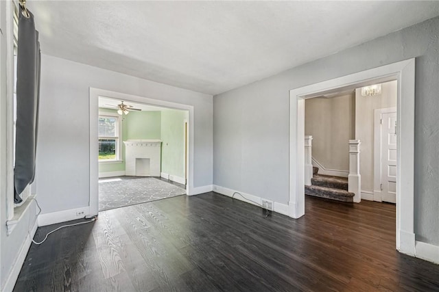 312 Edgewood Ave, Trafford, PA 15085 - spare room featuring wood finished floors, stairs, a chandelier, and ceiling fan