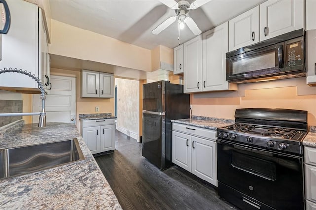 312 Edgewood Ave, Trafford, PA 15085 - kitchen with black appliances, dark wood-type flooring, a ceiling fan, and white cabinets