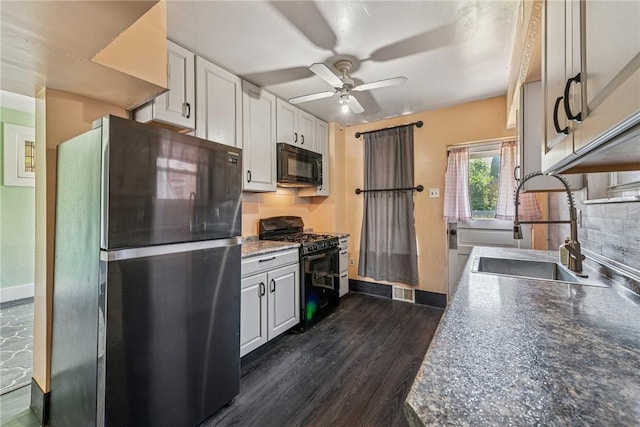 312 Edgewood Ave, Trafford, PA 15085 - kitchen with black appliances, ceiling fan, dark wood-style floors, and white cabinets