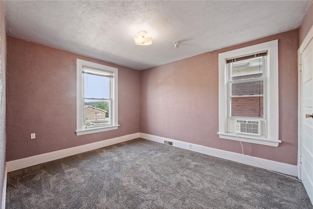 312 Edgewood Ave, Trafford, PA 15085 - carpeted empty room with a textured ceiling and cooling unit