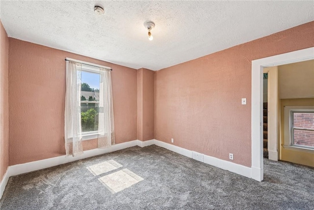 312 Edgewood Ave, Trafford, PA 15085 - carpeted spare room featuring a textured ceiling and a textured wall