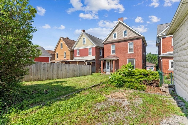 312 Edgewood Ave, Trafford, PA 15085 - back of house with brick siding and a chimney