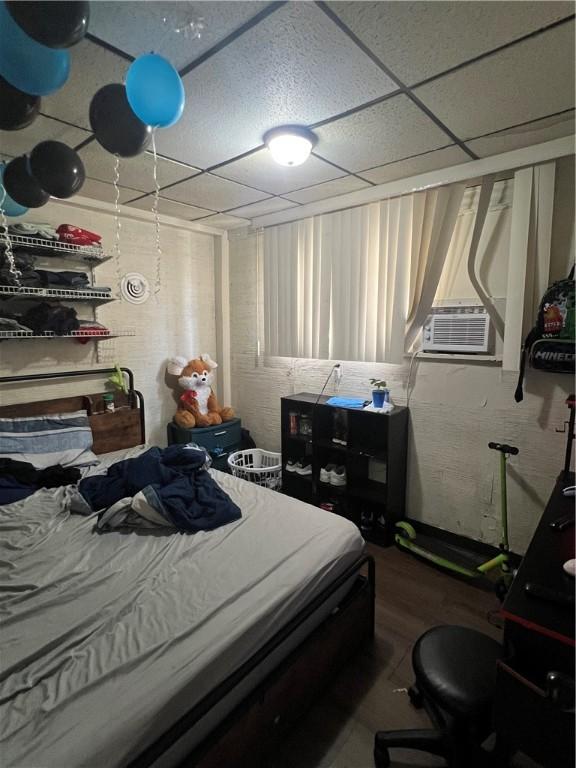 306 Fallowfield Ave, Charleroi Boro, PA 15022 - bedroom with a paneled ceiling, wood finished floors, and cooling unit
