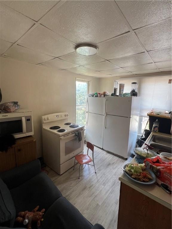 306 Fallowfield Ave, Charleroi Boro, PA 15022 - kitchen with white appliances, a drop ceiling, and light wood-style floors