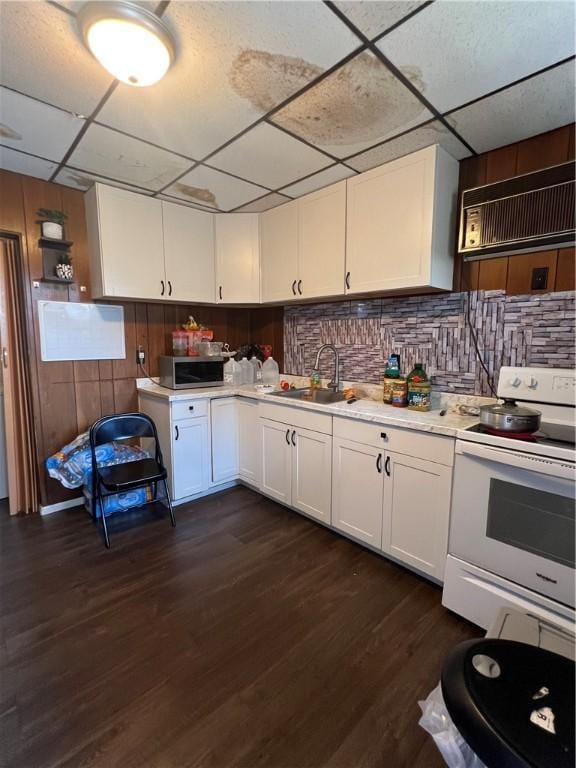 306 Fallowfield Ave, Charleroi Boro, PA 15022 - kitchen featuring white electric range, a paneled ceiling, light countertops, stainless steel microwave, and white cabinets