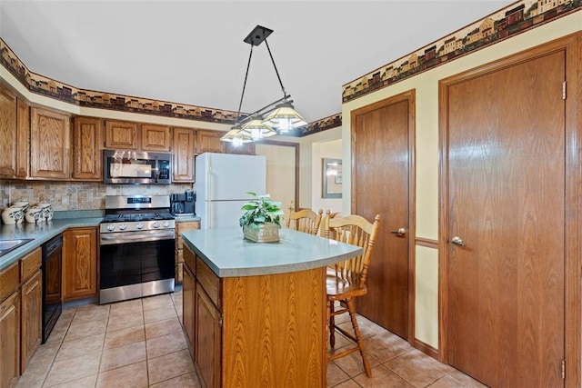 4581 Bakerstown Culmerville Rd, West Deer, PA 15044 - kitchen with appliances with stainless steel finishes, a kitchen island, brown cabinetry, light tile patterned flooring, and a breakfast bar area