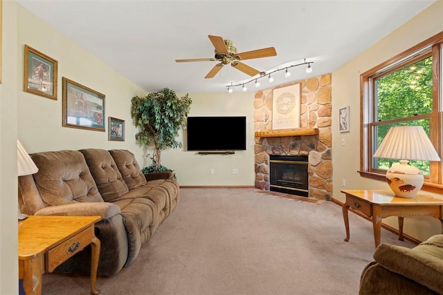4581 Bakerstown Culmerville Rd, West Deer, PA 15044 - living area with rail lighting, carpet, ceiling fan, and a stone fireplace