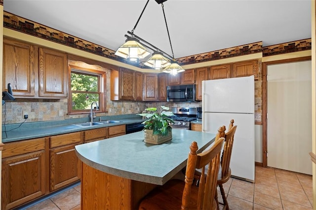 4581 Bakerstown Culmerville Rd, West Deer, PA 15044 - kitchen featuring freestanding refrigerator, stainless steel range oven, brown cabinets, backsplash, and light tile patterned floors