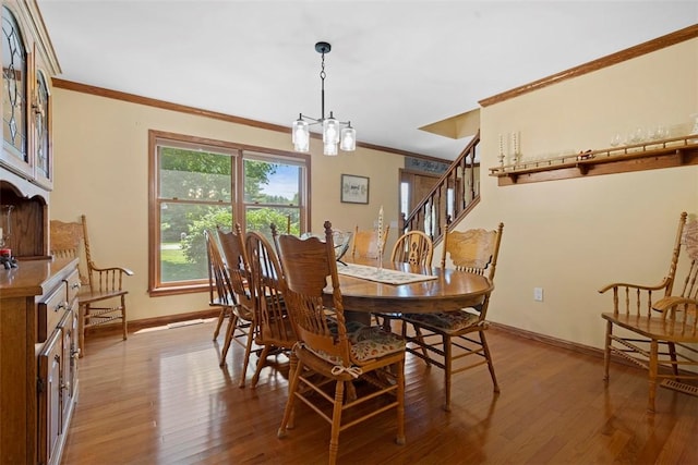 4581 Bakerstown Culmerville Rd, West Deer, PA 15044 - dining room with ornamental molding, a chandelier, light wood-style flooring, and stairway