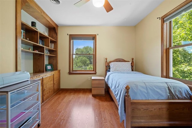 4581 Bakerstown Culmerville Rd, West Deer, PA 15044 - bedroom with multiple windows, light wood-style floors, and ceiling fan
