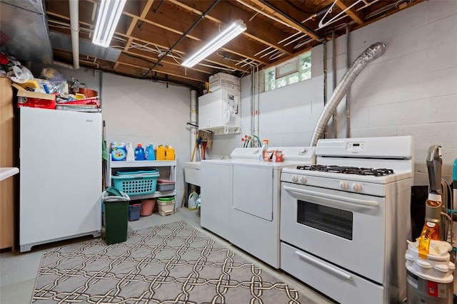 4581 Bakerstown Culmerville Rd, West Deer, PA 15044 - basement featuring separate washer and dryer, freestanding refrigerator, and concrete block wall