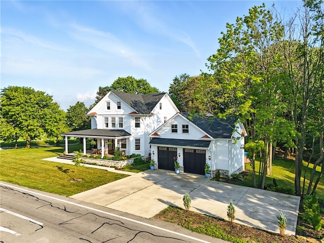 3901 Bakerstown Rd, Richland, PA 15044 - view of front of house with a porch, a front lawn, concrete driveway, and a shingled roof