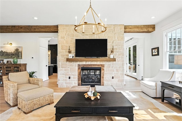 3901 Bakerstown Rd, Richland, PA 15044 - living room featuring wood finished floors, beamed ceiling, a chandelier, a stone fireplace, and recessed lighting