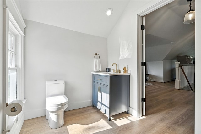 3901 Bakerstown Rd, Richland, PA 15044 - bathroom with lofted ceiling, wood finished floors, vanity, and recessed lighting