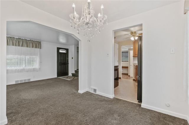 21 Garden Ter, Churchill Boro, PA 15221 - unfurnished room with dark colored carpet, a ceiling fan, arched walkways, and stairway