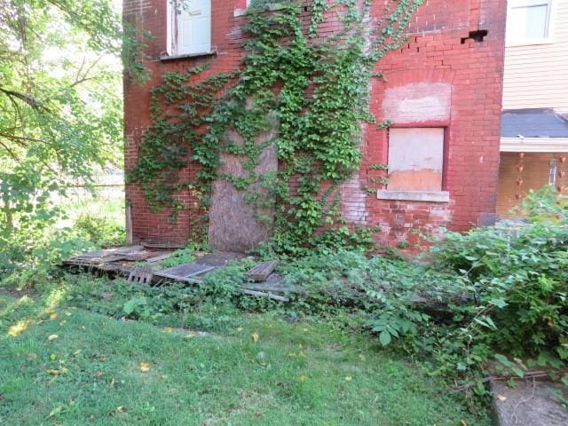 1407 N Lang Ave, Homewood Brushton, PA 15208 - exterior view of brick siding